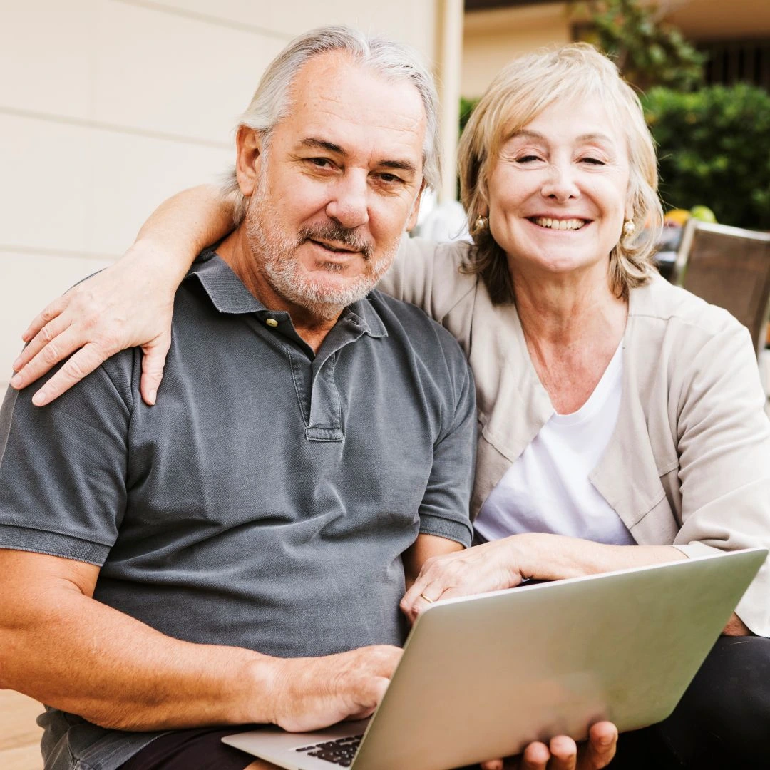 Senior couple sitting together outdoors